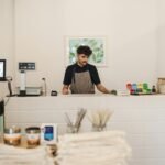 Eco-conscious retail environment showcasing a cashier at the counter.